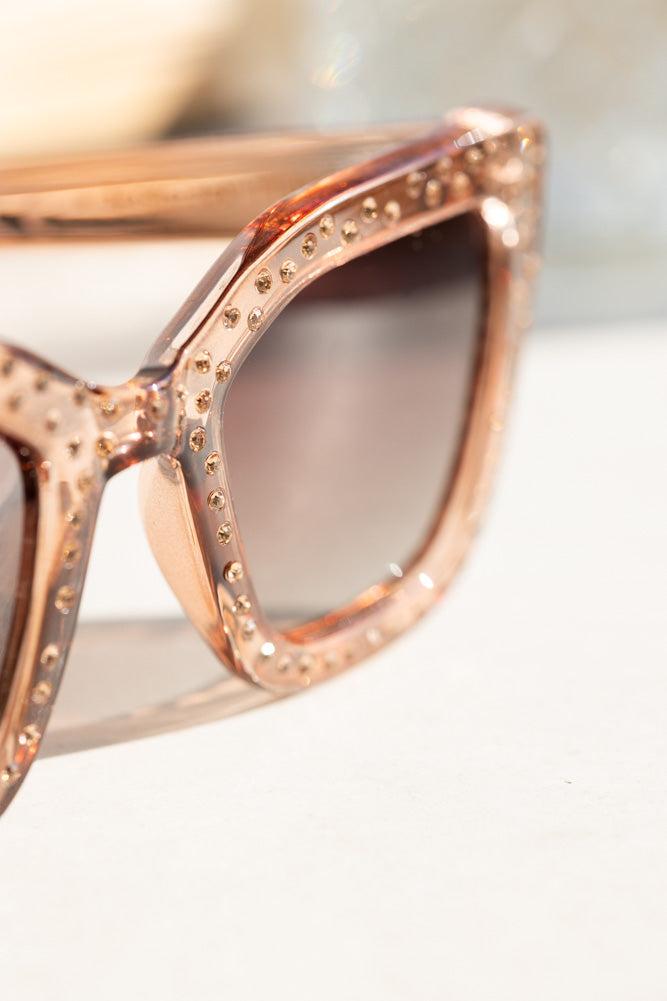 Lunettes de soleil à monture rose et strass