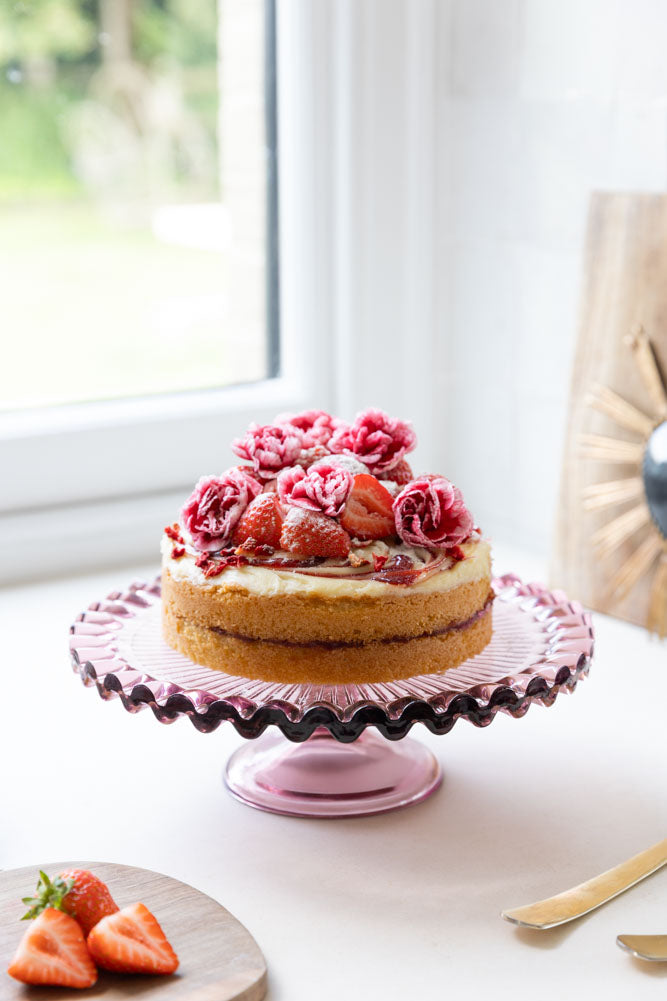 Joli présentoir à gâteaux en verre rose