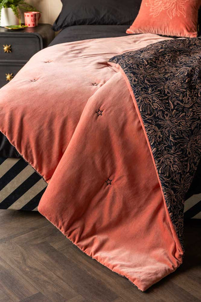 Couette réversible en velours noir et rose motif tigre