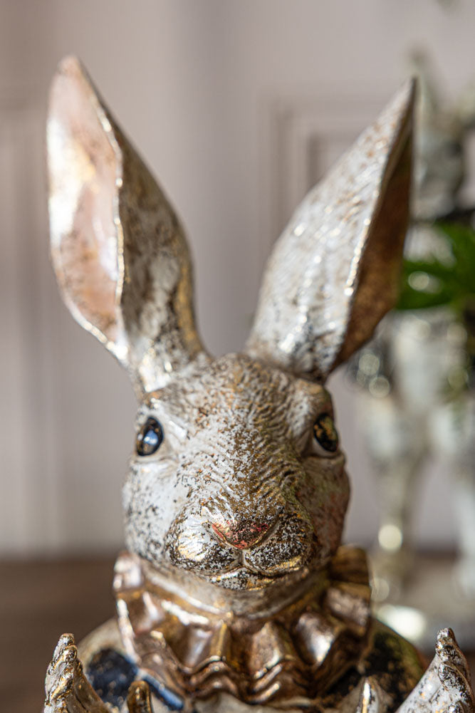 Fabuleux lapin applaudissant en or