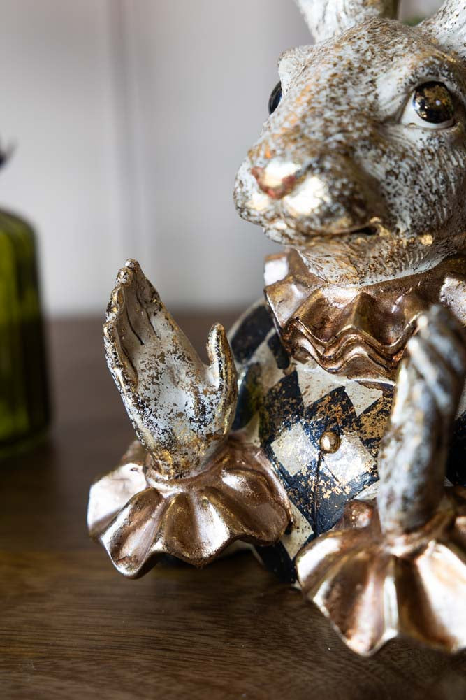 Fabuleux lapin applaudissant en or