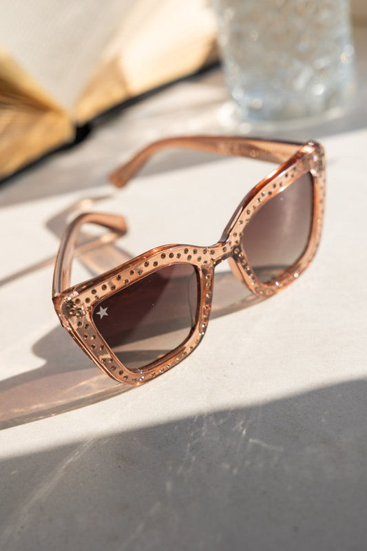 Lunettes de soleil à monture rose et strass