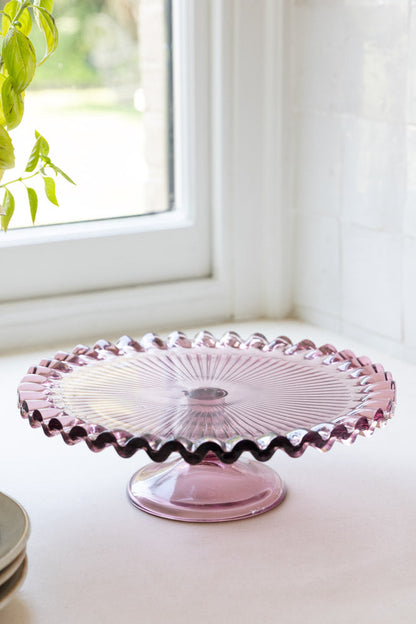 Joli présentoir à gâteaux en verre rose