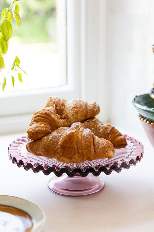Joli présentoir à gâteaux en verre rose