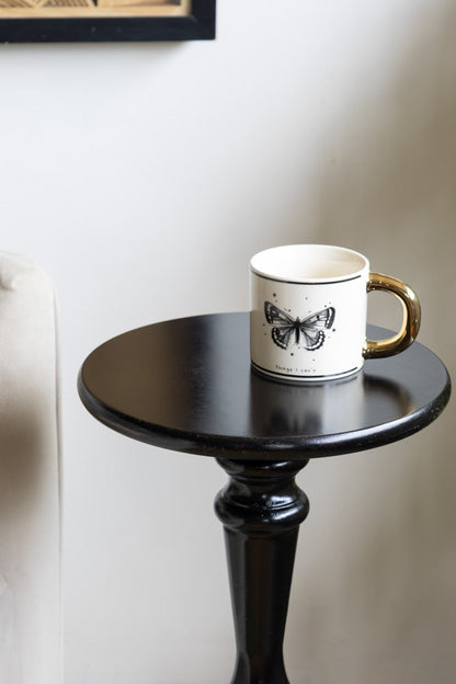 Table d'appoint noire en bois tourné